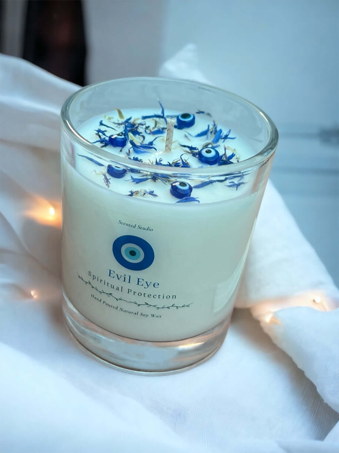 Introducing our Evil Eye Candle, crafted to bring both beauty and protection to your space.